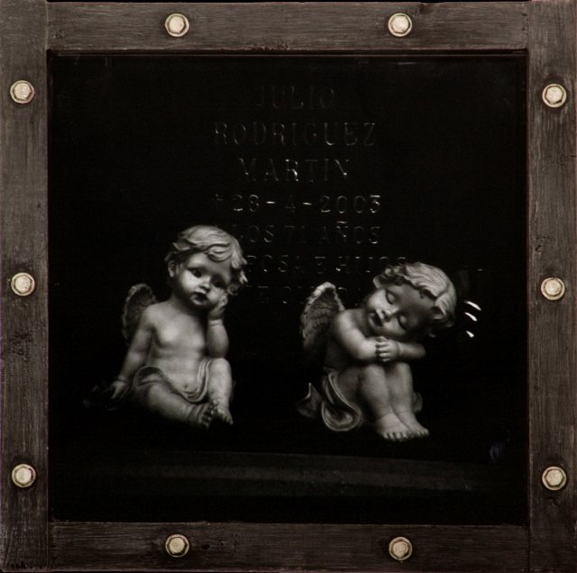 Cemetary Angels of Spain.jpg - “Cemetery Angels of Spain”   18 x 18 x 3”   Holga Photograph, Mixed Media on Wood Porthole Box Frame w/ Metal Bolts and Plexiglass   2007