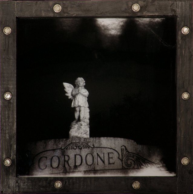 Cemetery Angel of San Francisco II.jpg - “Cemetery Angel of San Francisco II”   18 x 18 x 3”   Holga Photograph, Mixed Media on Wood Porthole Box Frame w/ Metal Bolts and Plexiglass 2007  