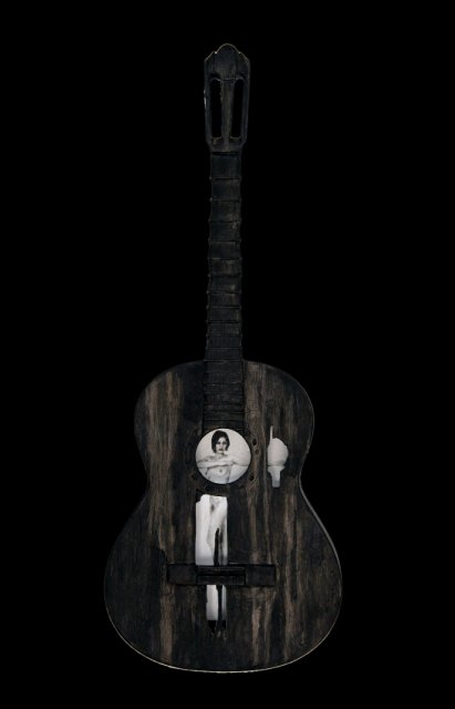 Beauty and a Broken Song II.jpg - “Beauty and a Broken Song II”   15 x 40 x 4”    Mixed Media on Burnt Guitar, Photograph     Photograph Developed by Jennifer Hart Biagiotti 2008  