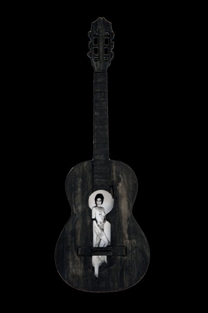 Beauty and a Broken Song IX .jpg - “Beauty and a Broken Song IX”   15 x 39 x 4”    Mixed Media on Burnt Guitar, Photograph   Photograph Developed by Jennifer Hart Biagiotti 2008  