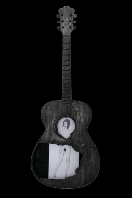 Beauty and a Broken Song VIII.JPG - “Beauty and a Broken Song VIII”   15 x 39 x 4”    Mixed Media on Burnt Guitar, Photograph   Photograph Developed by Jennifer Hart Biagiotti 2008  