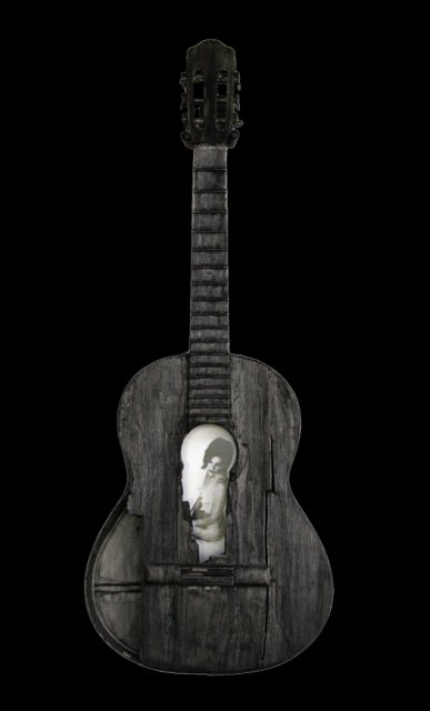 Beauty and a Broken Song XII.jpg - “Beauty and a Broken Song XII”   15 x 39 x 4”    Mixed Media on Burnt Guitar, Photograph   Photograph Developed by Jennifer Hart Biagiotti 2008  