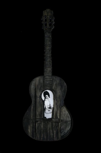 Beauty and a Broken Song.jpg - “Beauty and a Broken Song” 15 x 40 x 4”    Mixed Media on Burnt Guitar, Photograph     Photograph Developed by Jennifer Hart Biagiotti  